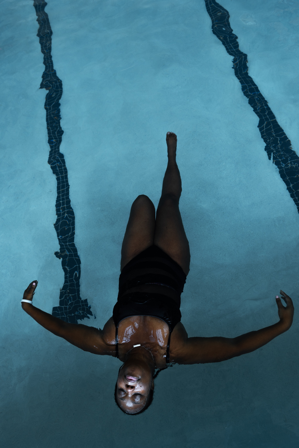 blue water pool relaxed swimmer